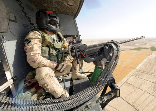 Canadian gunner, in the door of a Griffin helicopter, Kandahar District, 2011